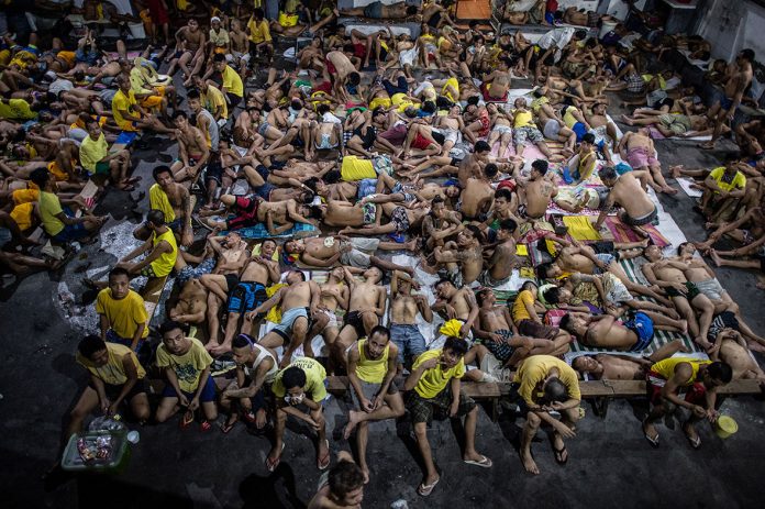 Inmates are cramped in a detention facility in Quezon City, in this photo taken in 2016. AFP