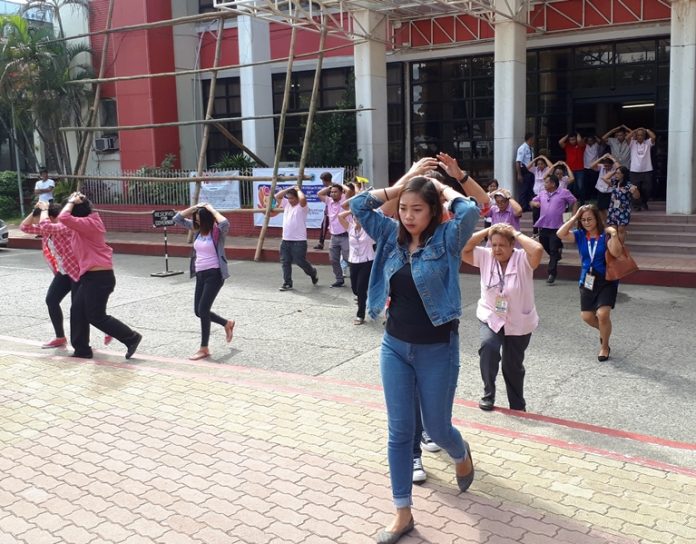 UNCANNY COINCIDENCE. Antique provincial government employees rush out of the capitol in the municipality of San Jose. An hour after an earthquake struck the province yesterday (Nov. 5, 2018), Antiqueños took part in a scheduled fourth quarter nationwide simultaneous earthquake drill with San Jose as the ceremonial site in Western Visayas. TWV, PIA-ANTIQUE