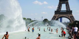 People cool off in the Trocadero fountains across from the Eiffel Tower in Paris as a heatwave hit much of the country, France. The government is postponing exams, opening pools and urging residents to stay hydrated. AP VIA WASHINGTON POST