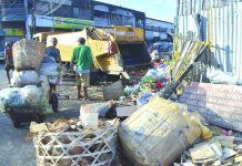 Commissioned personnel collect garbage at the Iloilo Terminal Market in Iloilo City. The Ecological Solid Waste Management Act of 2000 mandates local government units to adopt a systematic, comprehensive and ecological solid waste management program in their areas. IAN PAUL CORDERO