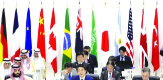 Japan’s Prime Minister Shinzo Abe, front row center, speaks while Saudi Crown Prince Mohammed bin Salman, front row left, and Argentina's President Mauricio Macri, front row right, listen during a working lunch at the Group of 20 (G-20) summit in Osaka, western Japan, Friday, June 28, 2019. AP