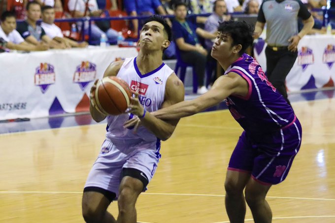 Ilonggo Ferdinand “Thirdy” Ravena III of Cignal HD-Ateneo Blue Eagles gets held down by a Centro Escolar University Scorpions defender as he attempts for a layup. PBA