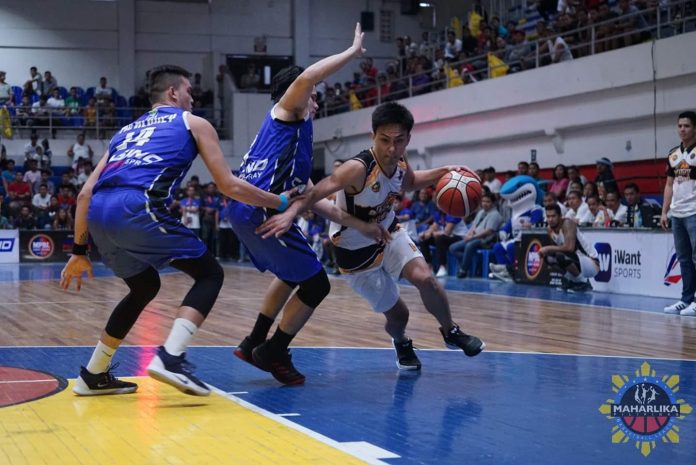 Biñan City Krah Heroes’ Allan Mangahas attacks two Cebu Sharks defenders. MPBL