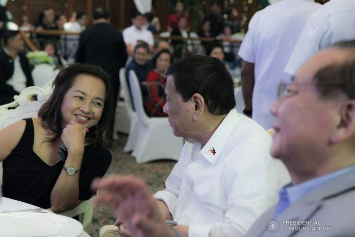 President Rodrigo Roa Duterte shares a light moment with House Speaker Gloria Macapagal-Arroyo during the appreciation dinner for the House Speaker at The Manila Hotel on July 9, 2019. PRESIDENTIAL PHOTO