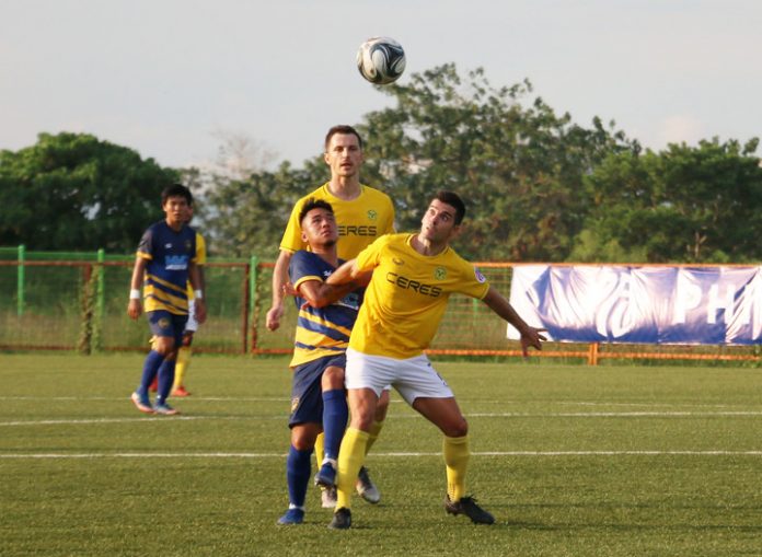 Ceres-Negros FC’s Bienvenido Marañon fights with a Global-Cebu FC player for a loose ball during their June 1, 2019 match. PFL PHOTO