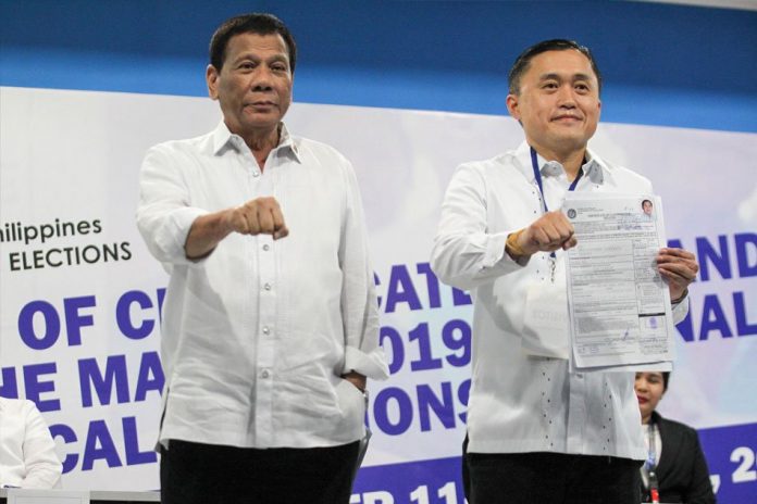 Neophyte Sen. Christopher “Bong” Go (right) says there will be no “conflict of interest” with his work at the Senate despite his close relationship with President Rodrigo Duterte. ABS-CBN NEWS