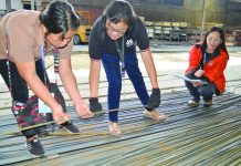 Commissioned personnel of the Department of Trade and Industry inspect these steel bars at a random hardware shop in Iloilo City on Friday, July 5. DTI REGION 6