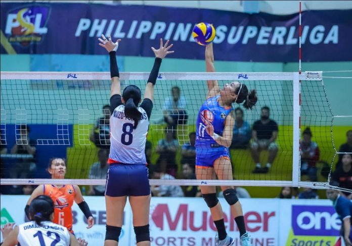 Ilongga Fiola Ceballos of Generika-Ayala Lifesavers dumps the ball against the defense of fellow Ilongga Aiza Maizo-Pontillas of Petron Blaze Spikers. PSL PHOTO