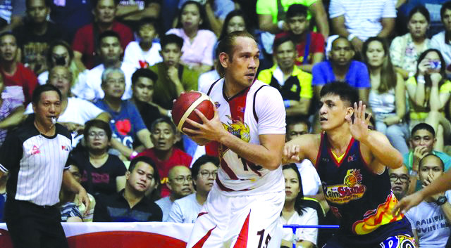 San Miguel Beermen’s June Mar Fajardo protects the leather as Rain or Shine Elasto Painters’ Jewel Ponferrada anticipates a steal. PBA