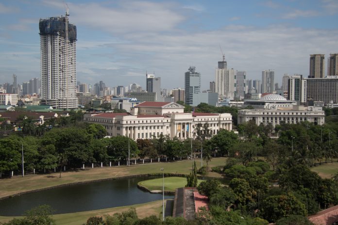 Photo shows the Manila skyline as seen from the walled city of Intramuros. WIKIMEDIA