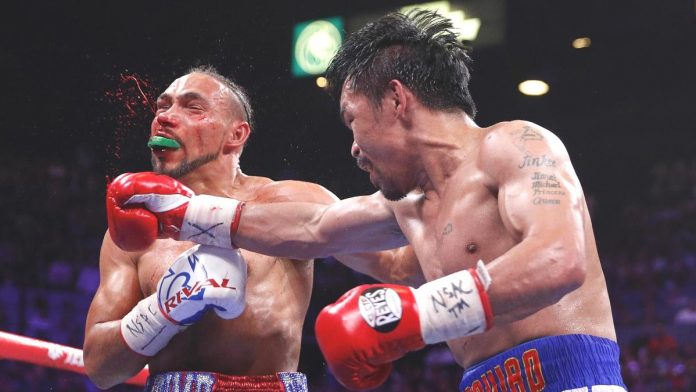 BIG BLOW. Keith Thurman connects with a shot to the face of Manny Pacquiao during Round 6 of their WBA super welterweight world championship fight in the MGM Grand Garden Arena in Las Vegas, Nevada, USA. L.E. BASKOW, LAS VEGAS REVIEW-JOURNAL