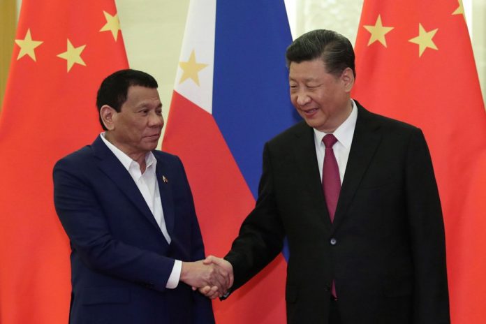 President Rodrigo Duterte (left) has the authority to enter “executive” agreements, including a verbal deal with Chinese President Xi Jinping on fishing rights in the Philippines’ exclusive economic zone, says Presidential Spokesman Salvador Panelo. ABS-CBN NEWS