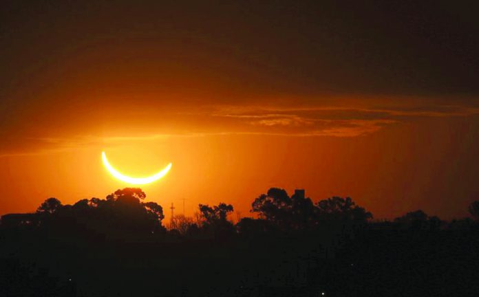 The moon passes in front of the setting sun during a total solar eclipse in Buenos Aires, Argentina, Tuesday, July 2, 2019. A solar eclipse occurs when the moon passes between the Earth and the sun and scores a bull’s-eye by completely blocking out the sunlight. AP