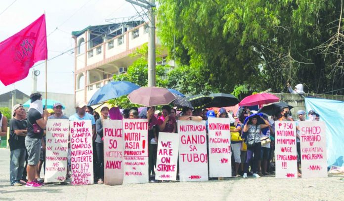 Labor secretary Silvestre Bello III emphasized that the cases of “violence and murder, brutal repression of public protests, and repressive laws” among workers are all allegations as the cited accusations are not officially reported as labor-related incidents. PHOTO FROM ANAKBAYAN UST