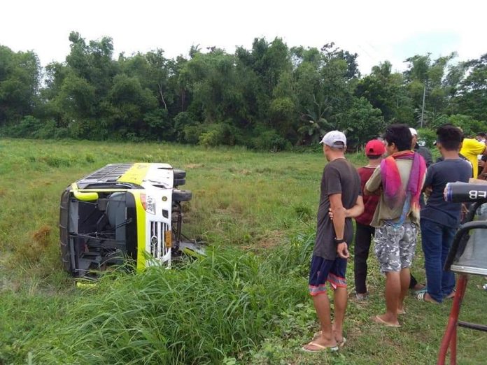 This Ceres bus lands on its side after tumbling down the highway in Barangay Zerrudo, Sara, Iloilo yesterday, Aug. 7, 2019. Ten passengers were hurt. CONTRIBUTED PHOTO