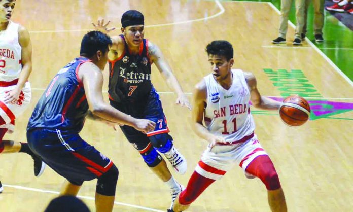 Ilonggo Clint Doliguez of San Beda University Red Lions picked up his dribble after being hounded by two Letran Knights defenders. TIEBREAKER TIMES PHOTO