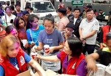 Survivors of Aug. 3, 2019’s sea mishap at the Iloilo Strait are being provided with food by the Iloilo City government at the Iloilo Ferry Terminal-Parola. Mayor Jerry Treñas (standing, second from right) oversees the activity.