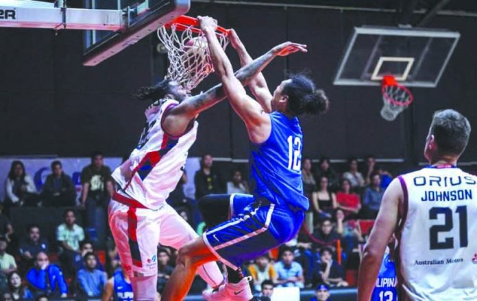 Gilas Pilipinas’ Japeth Aguilar posterizes an Adelaide 36ers player with a dunk. SPIN.PH PHOTO