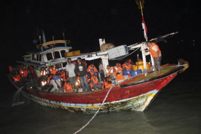 Aferry that caught fire off Java island is seen preparing to dock at a port in Sumenep, Indonesia on Aug. 23, 2019. AP