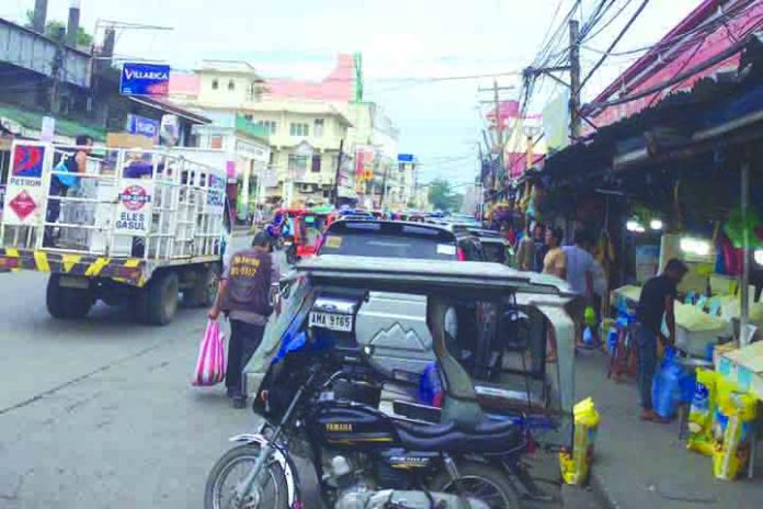 This sidewalk in downtown Kalibo is being used as tiangge, parking area, sari-sari store, and house extension. A municipal transportation task force was recently created to clear all erring structures illegally erected in public roads in the capital town. BOY RYAN ZABAL/PN