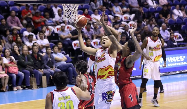 Rain or Shine Elasto Painters’ Norbert Torres muscles his way against the defense of San Miguel Beermen’s Chris McCullough. PBA PHOTO