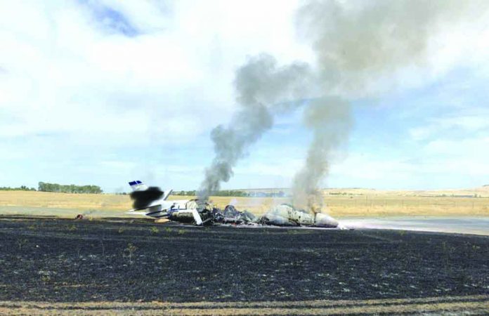 A jet burst into flames after aborting a takeoff Wednesday, Aug. 21, 2019, in Oroville, California, USA. Officials say a small jet burst into flames while trying to take off from a small Northern California airport, but all 10 people on board escaped injury. AP