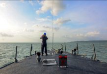 SEARCH FOR SURVIVORS. Onboard BRP Alfredo Pecson, a Philippine Navy personnel scans the vast expanse of the Iloilo Strait in the hope of finding more survivors from Saturday’s (Aug. 3, 2019) capsizing of three motorboats hit by a squall. Twenty-eight persons have so far been confirmed to have drowned. IAN PAUL CORDERO/PN