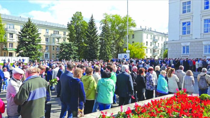 In this grab taken from a footage provided by the Russian State Atomic Energy Corporation ROSATOM press service, people gather for the funerals of five Russian nuclear engineers killed by a rocket explosion in Sarov, the closed city, located 370 kilometers east of Moscow on Aug. 12, 2019. AP