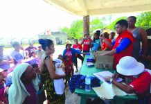 RELIEF OPERATION. Personnel of the Department of Social Welfare and Development distribute relief goods to residents of Barangay Lantangan in Isla Gigantes, Carles, Iloilo on Aug. 10. IAN PAUL CORDERO/PN