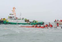 DEADLY SEA MISHAP. Coast guard officials brave the rough waters to search for victims after three motorized boats capsized off Iloilo Strait in separate incidents around noontime yesterday. According to disaster-mitigation authorities, 11 people were confirmed dead. IAN PAUL CORDERO