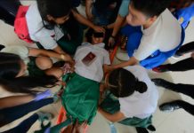 STRANGE HAPPENING. Teachers and students of Iloilo City National High School help one another restrain this high school girl who became unusually strong and uncontrollable. She was one of 11 students who behaved strangely yesterday morning, Aug. 22, 2019. Were they possessed by evil spirits? IAN PAUL CORDERO/PN