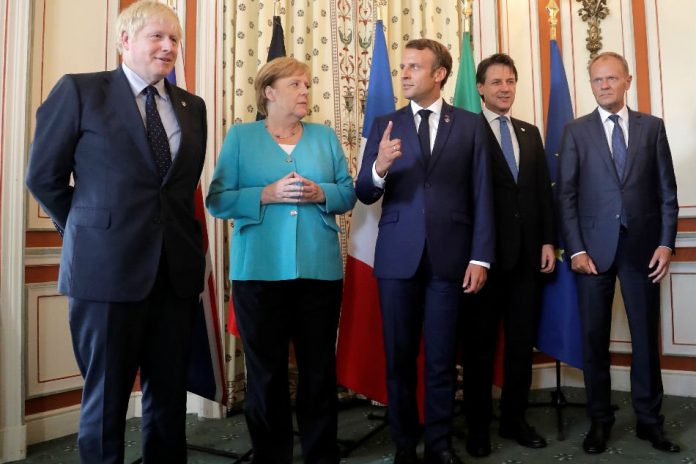 Britain’s Prime Minister Boris Johnson, German Chancellor Angela Merkel, French President Emmanuel Macron, Italy's acting Prime Minister Giuseppe Conte and President of the European Council Donald Tusk pose during a G7 coordination meeting with the Group of Seven European members at the Hotel du Palais in Biarritz, France Aug. 24, 2019. REUTERS