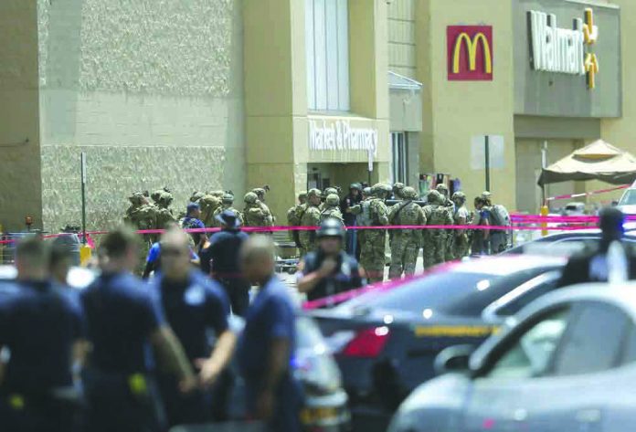 Several law enforcement agencies respond to an active shooter Saturday, Aug. 3, 2019, at a Walmart in El Paso, Texas. AP