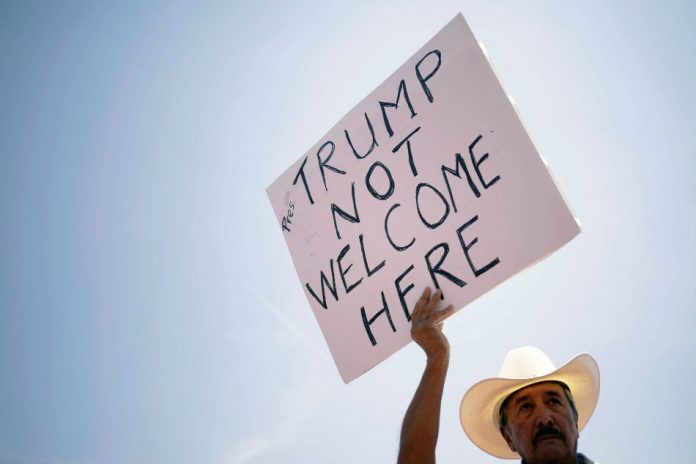 A man takes part in a rally against the visit of the U.S. President Donald Trump after a mass shooting at a Walmart store, in El Paso, Texas, U.S., Aug. 7, 2019. REUTERS