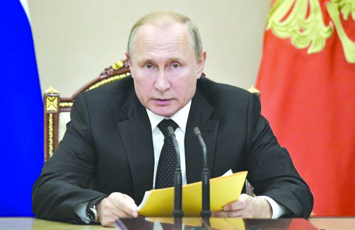 Russian President Vladimir Putin speaks at a meeting with members of the Security Council in the Kremlin in Moscow, Russia, Friday, Aug. 23, 2019. AP