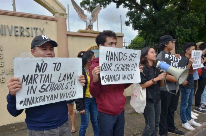 Students of West Visayas State University in La Paz, Iloilo City oppose the planned deployment of soldiers in schools. They warn of a creeping martial law in academic institutions. IAN PAUL CORDERO/PN