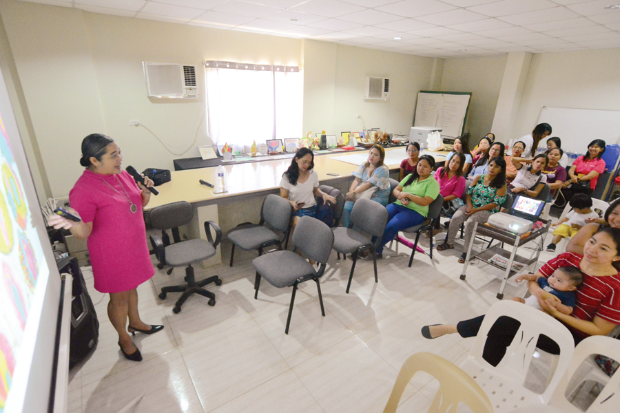 Dr. Gemma gives a talk to the women of Panay News.