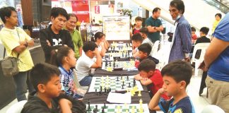 Elementary chess players in action during the 2019 Inter-Elementary School Dalawahan Chess Competition at the GT Town Center in Pavia, Iloilo. PAVIA CHESSERS PHOTO