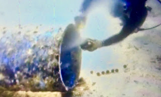 A diver gets an actual water sample at an outfall in Boracay Island on Sept. 21. AKEAN FORUM