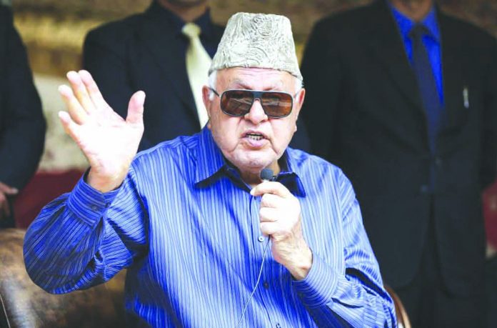 National Conference president Farooq Abdullah addresses his supporters during an election campaign rally in Srinagar, Indian controlled Kashmir. AP