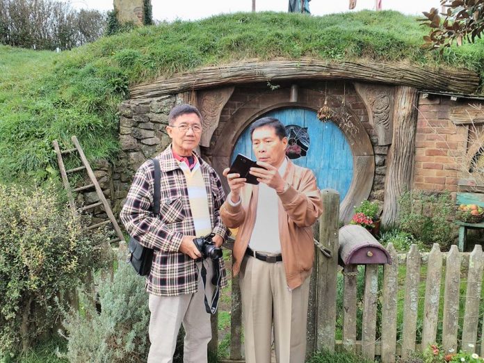 DANNY FAJARDO (right) on vacation with columnist Herbert Vego at Hobbiton Village, New Zealand.