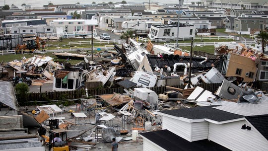 Mobile homes are upended and debris is strewn about at the Holiday Trav-l Park, Thursday, Sept. 5, 2019, in Emerald Isle, N.C, after a possible tornado generated by Hurricane Dorian struck the area. Photo by Julia Wall/The News & Observer