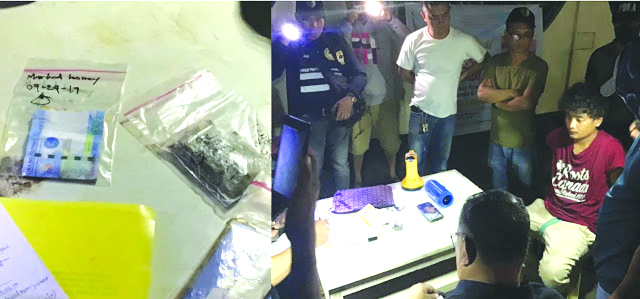 Suspected drug pusher Jose Benuelle Delgado sits handcuffed. Police caught him selling drugs to a poseur-buyer in Barangay Andagao, Kalibo, Aklan on Sept. 24. BOY RYAN ZABAL/AKEAN FORUM