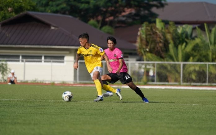 Jose Elmer Porteria of Ceres Negros FC puts the ball away from Stallion Laguna FC’s Kou Belgira’s reach. PFL PHOTO