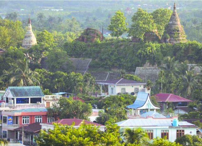 A landscape view of the downtown with ancient pagodas in the background in Mrauk U, Rakhine state, Myanmar June 28, 2019. REUTERS