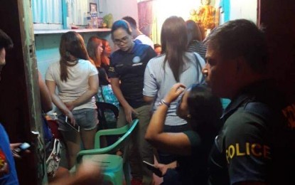 Operatives of the Criminal Investigation and Detection Group rescue these women from alleged human traffickers in an operation in Barangay Mabolo, Iloilo City on Friday night. CIDG 6