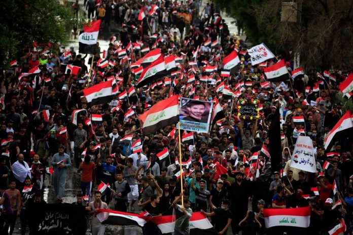 Demonstrators take part in a protest over corruption, lack of jobs and poor services in Najaf, Iraq on Oct. 25. REUTERS/ALAA AL-MARJANI