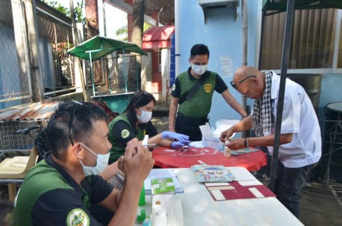 UNANNOUNCED DRUG TEST. A bus driver submits a urine sample to Philippine Drug Enforcement Agency Region 6 personnel for drug testing. This “surprise” drug test at a transport terminal in Molo, Iloilo City on Monday, Oct. 28, 2019, is part of government measures to ensure the safety of travelers marking All Saints’ Day on Nov. 1 and All Souls’ Day on Nov. 2. The drug test has the support of the Land Transportation Office and Police RegiOnal Office 6. IAN PAUL CORDERO/PN