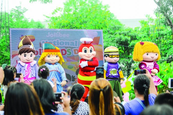 Jollibee performs on stage with the Jollitown squad.