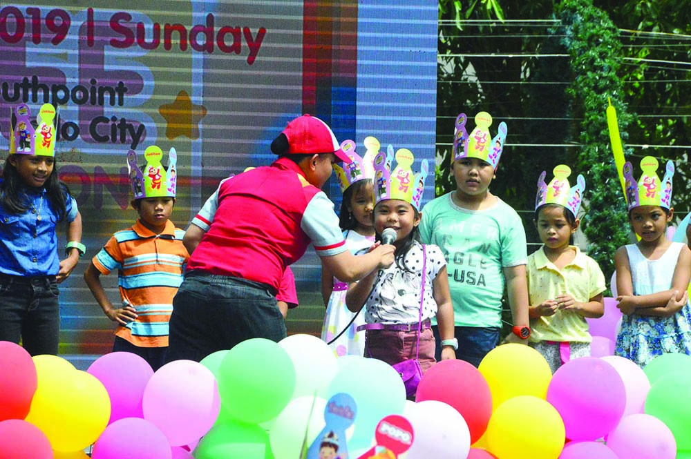 Jolly kids participate in on-stage games